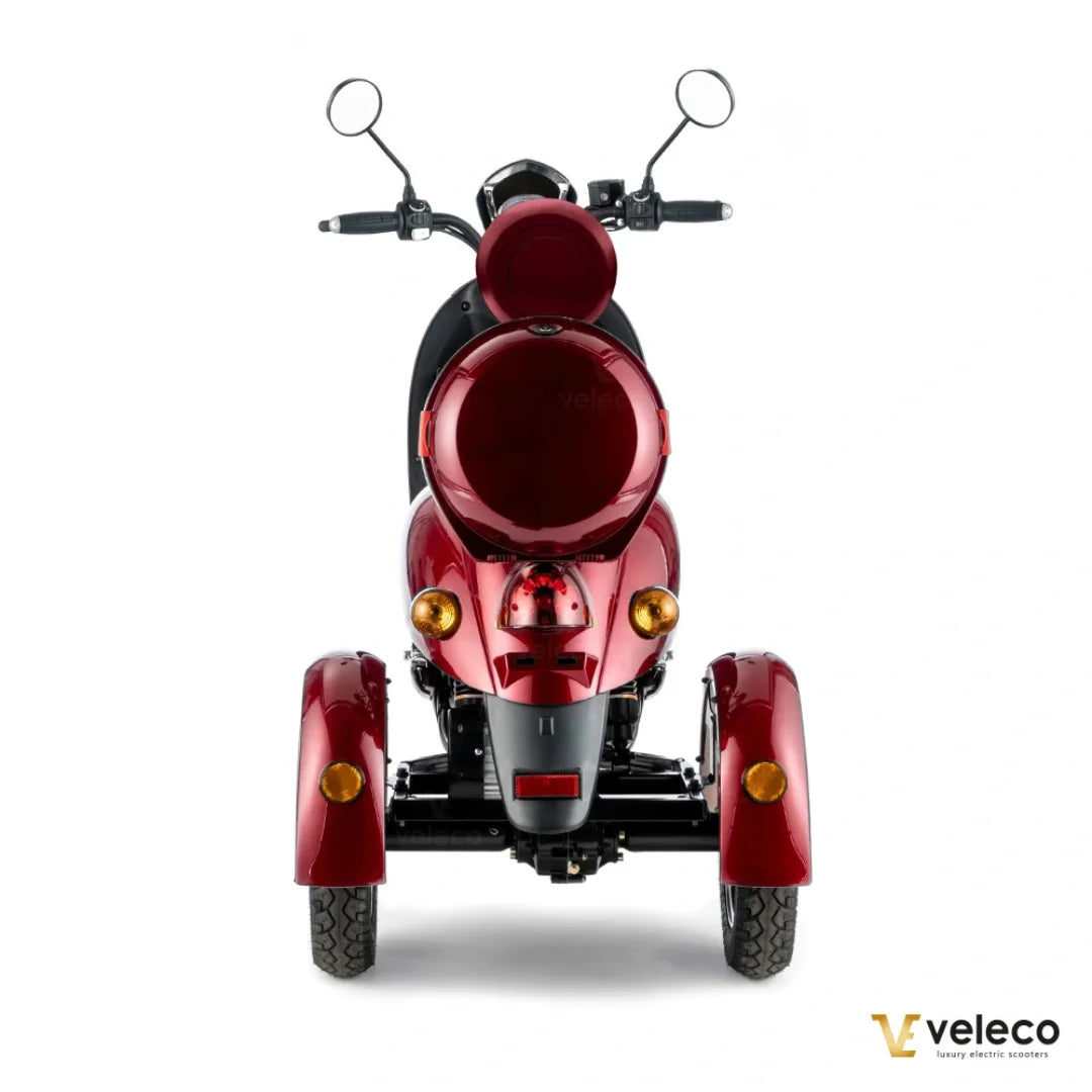 Electric Mobility Scooter Veleco Zt63 features a stylish red design, three wheels, and ergonomic handlebars for stability.