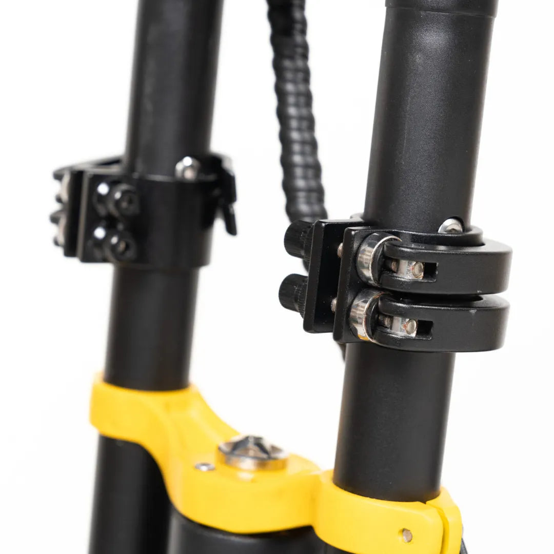 Electric Scooter Vsett 11 Super features robust black and yellow construction, showcasing sturdy clamps and a stable design.