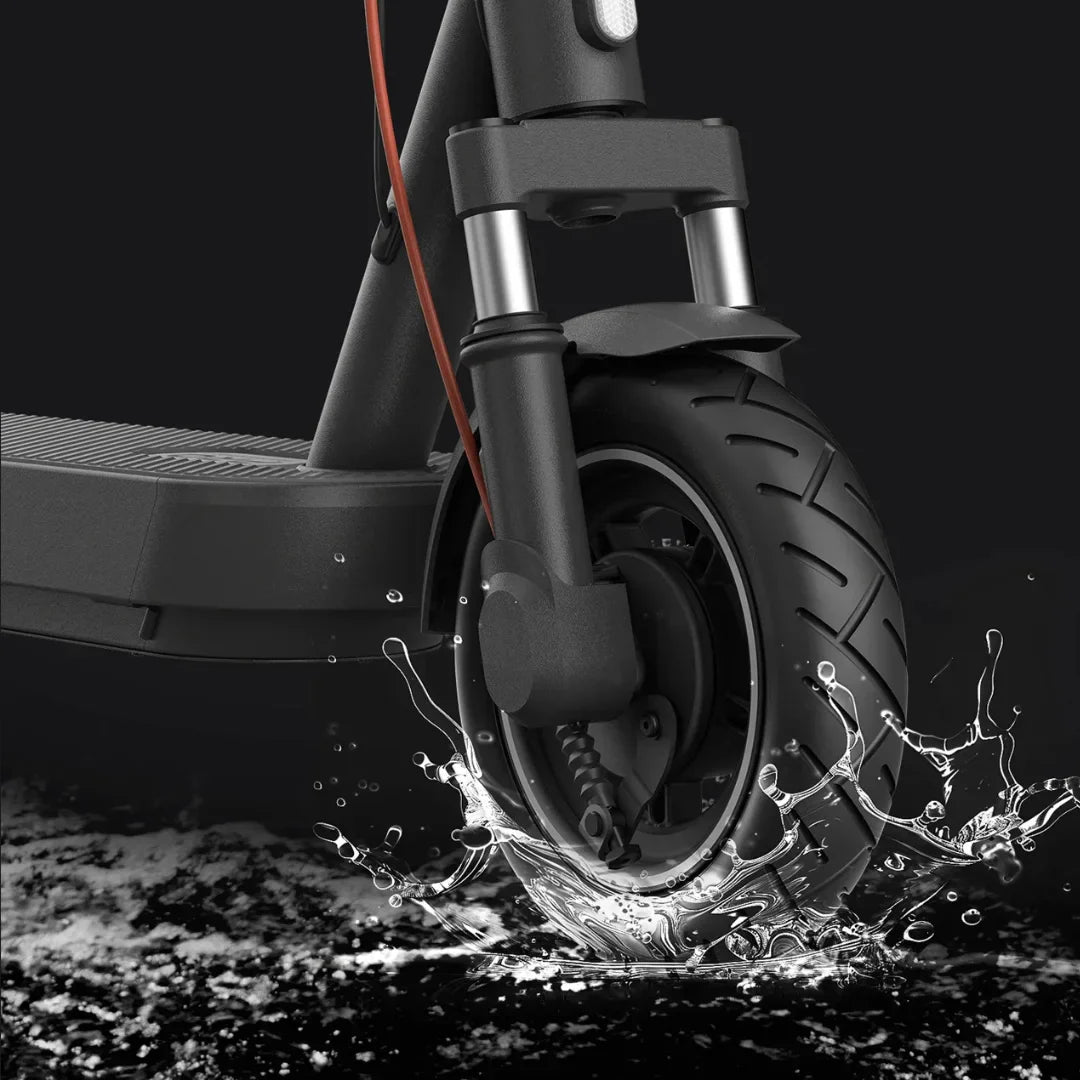 Electric Scooter Xiaomi 5 Pro features a robust tire splashing through water, showcasing its durability and performance.