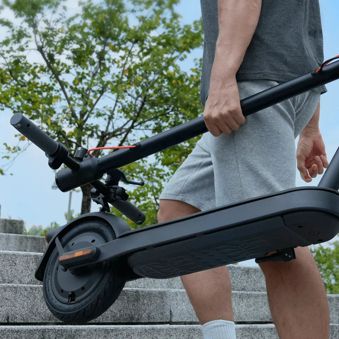 Electric scooter Xiaomi Elite – person carrying up stairs