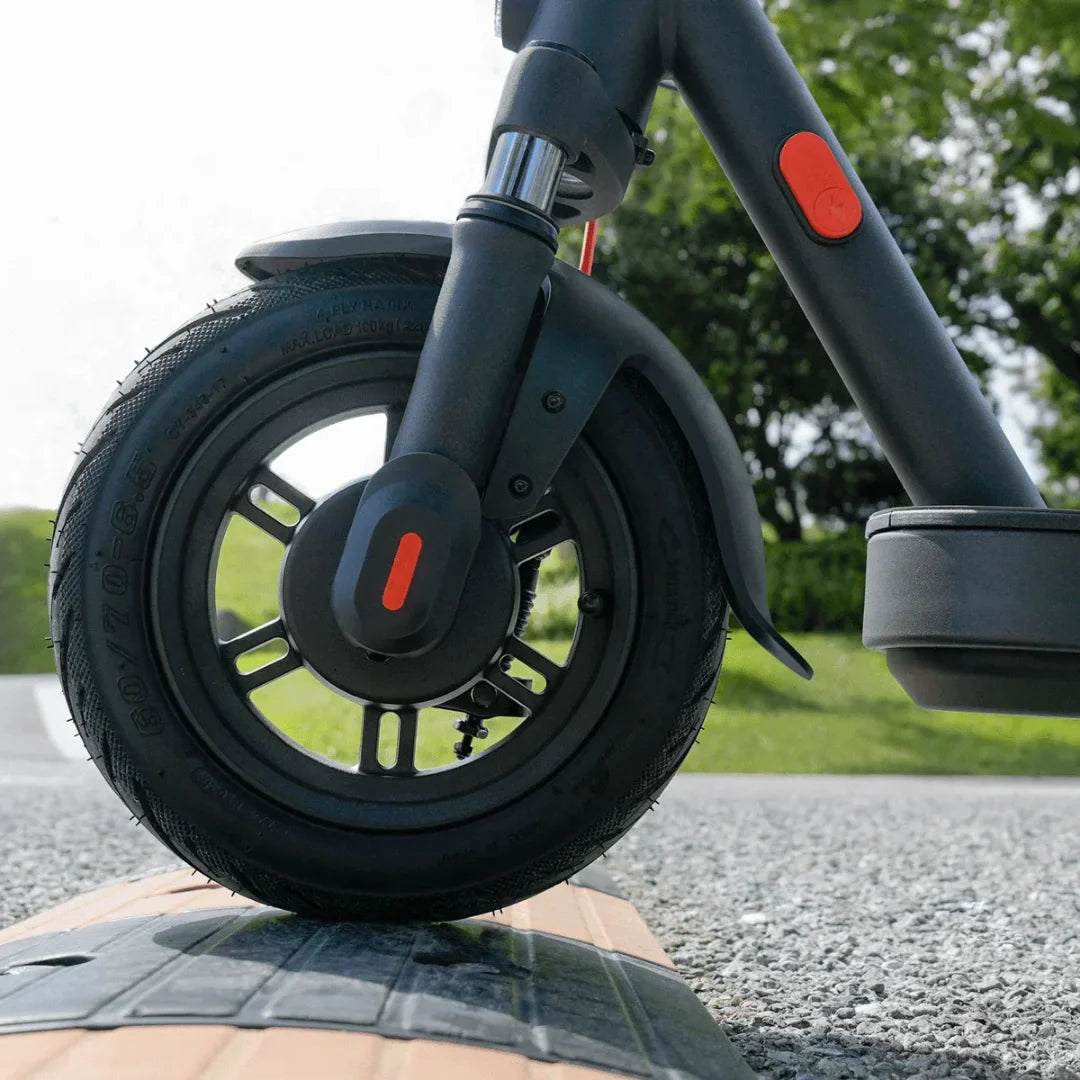 Electric Scooter Xiaomi Elite features a sleek design, sturdy black wheel, and eye-catching red button for enhanced experience.