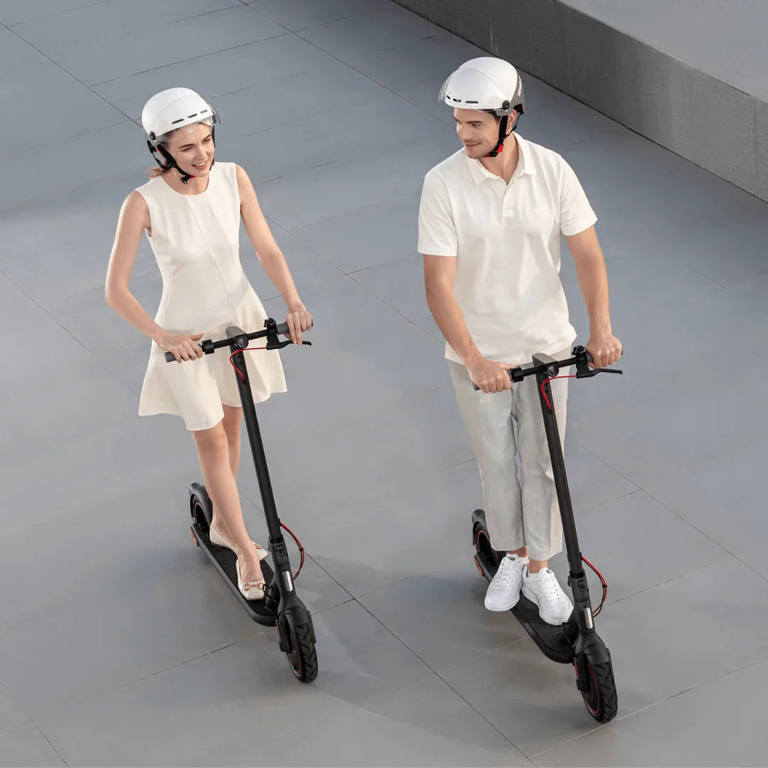 Electric Scooter Xiaomi 4 Eu, featuring two riders in casual attire with helmets, on a sleek pavement.