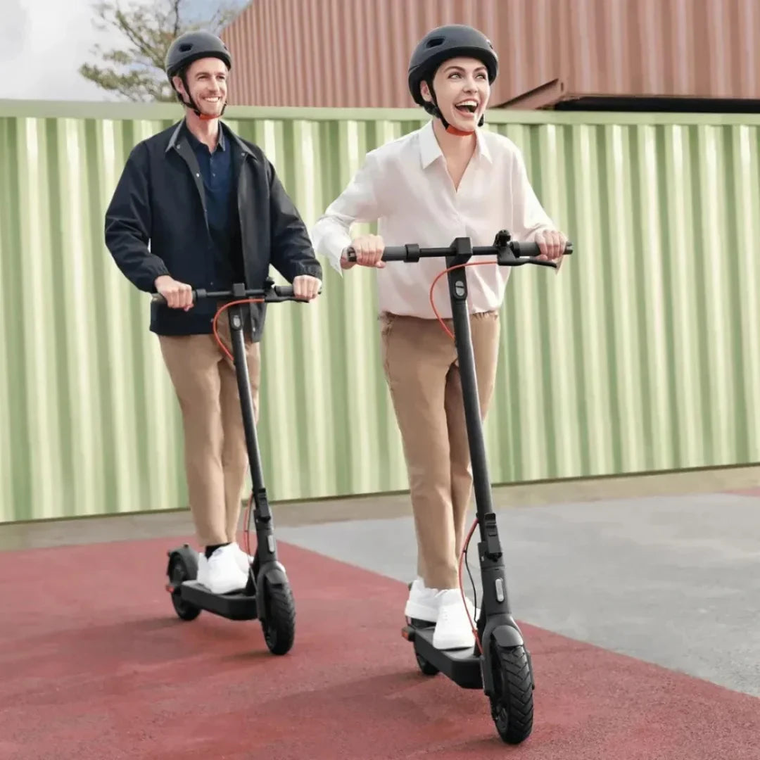 Electric Scooter Xiaomi 4 Pro 2nd Gen features two riders enjoying a fun ride outdoors, wearing helmets.