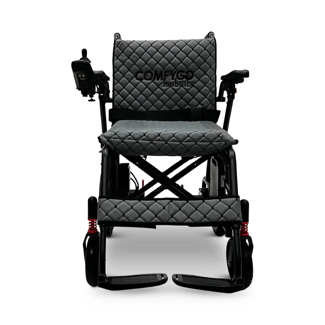 Electric wheelchair ComfyGO X7 – front view, unfolded, with gray quilted seat and backrest, footrests down