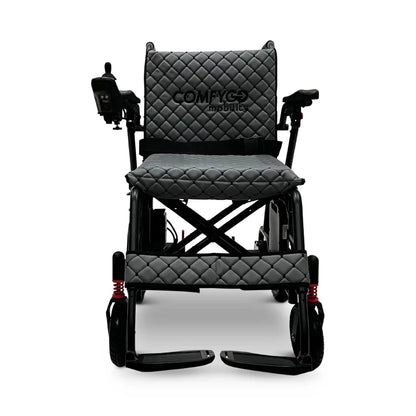 Electric wheelchair ComfyGO X7 – front view, unfolded, with gray quilted seat and backrest, footrests down