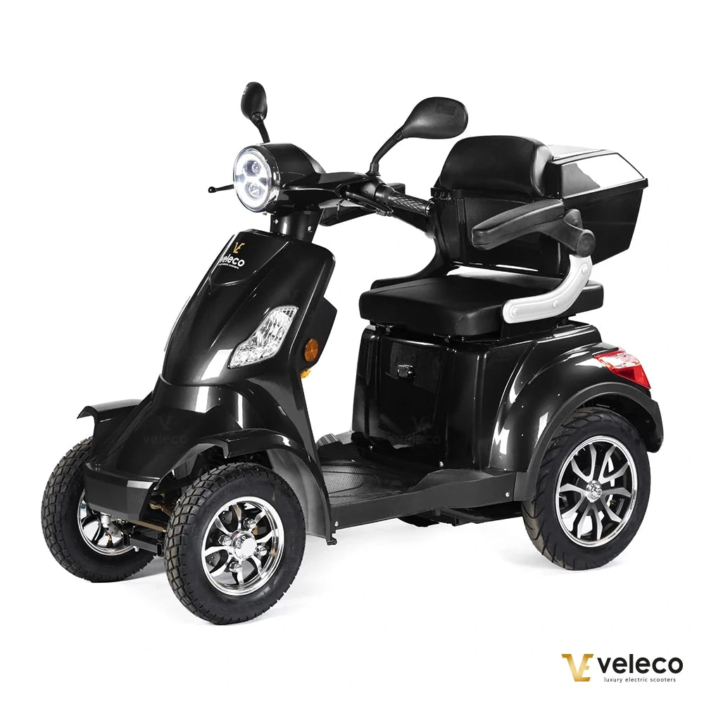 Veleco Faster – black four-wheel scooter with rear storage box