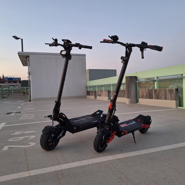 Electric scooter Teverun Fighter SUPREME 7260 Ultra 2026 – two scooters in parking garage, side view
