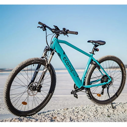Electric Bike Econic One Cross Country features a sleek turquoise frame, rugged tires for diverse terrains, ideal for outdoor adventures.